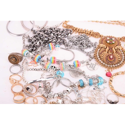 146 - A quantity of base metal costume jewellery including Indian Wedding suites, bangles with some hinged... 