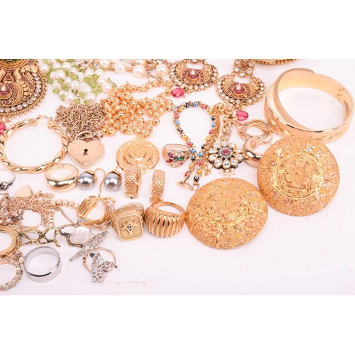 146 - A quantity of base metal costume jewellery including Indian Wedding suites, bangles with some hinged... 