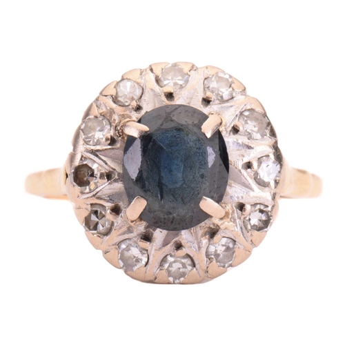 149 - A sapphire and diamond cluster ring, set to the centre with a sapphire measuring 7.9 x 6.6mm, encirc... 