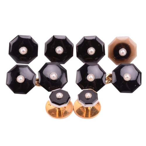 15 - An Art Deco set of onyx cufflinks and dress studs with seed pearl centres, of octagon design, onyx p... 