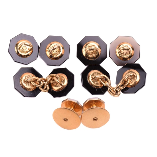 15 - An Art Deco set of onyx cufflinks and dress studs with seed pearl centres, of octagon design, onyx p... 