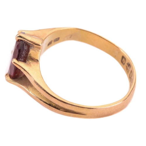 165 - A garnet single stone ring, the almandine garnet measuring 10 x 7.9mm, in a claw setting, the shank ... 