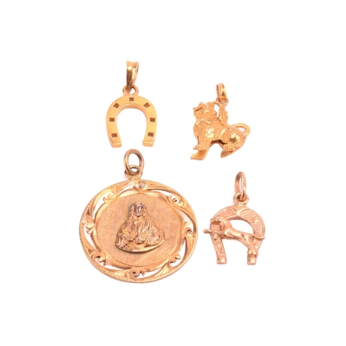 17 - A Chinese pendant with a symbol for prosperity, a Chinese Qilin charm, and two horseshoe charms, all... 