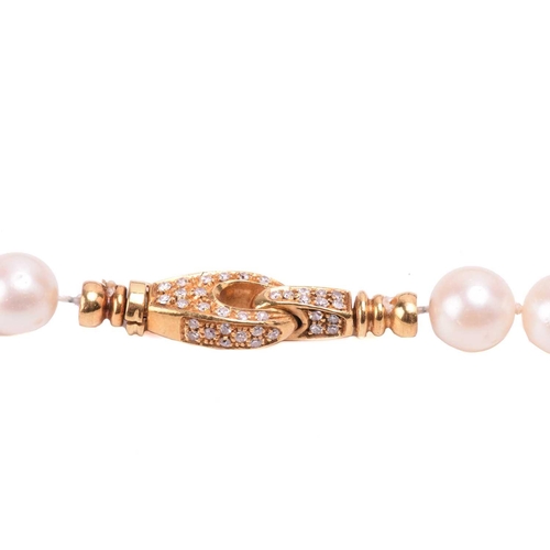 177 - A single-strand cultured pearl necklace, the seventy-nine uniform white pearls with subtle pink over... 