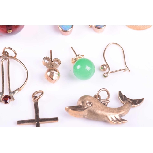 18 - A mixed collection of earrings together with a 9ct gold dolphin pendant, a 9ct gold cross and a spra... 