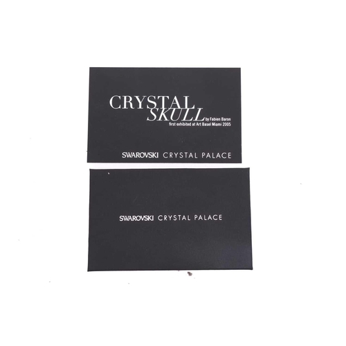 184 - A Fabian Baron for Swarovski Crystal Palace white Crystal Skull, in the original box of issue with c... 