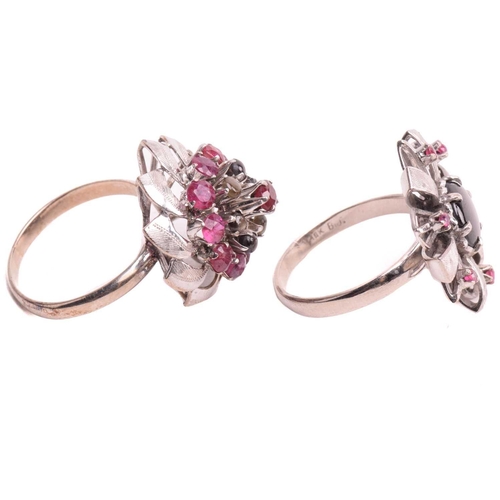 189 - Two floral cocktail rings set with ruby and black star sapphire; the first centred with a round blac... 