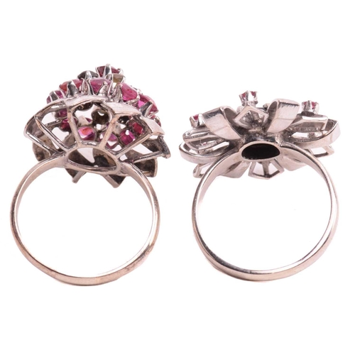 189 - Two floral cocktail rings set with ruby and black star sapphire; the first centred with a round blac... 