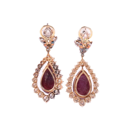 199 - A pair of ruby and diamond pendant earrings, each set with a large pear-shaped diamond, with an esti... 