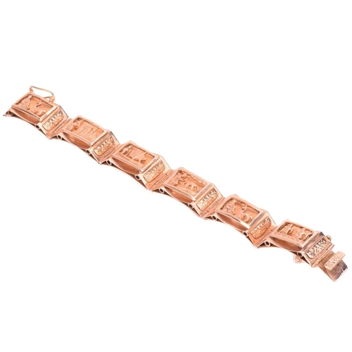 2 - A storyteller panel bracelet, modelled as a sequence of six bevelled rectangular panels with cut-out... 