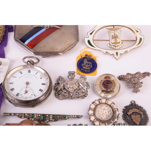 20 - A group of mixed military sweetheart brooches, cap badges and a silver an enamel RAF compact, togeth... 