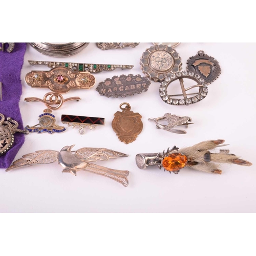 20 - A group of mixed military sweetheart brooches, cap badges and a silver an enamel RAF compact, togeth... 