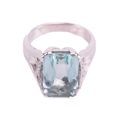 201 - A single stone aquamarine dress ring, the mixed rectangular cut aquamarine, with double claw mounts,... 