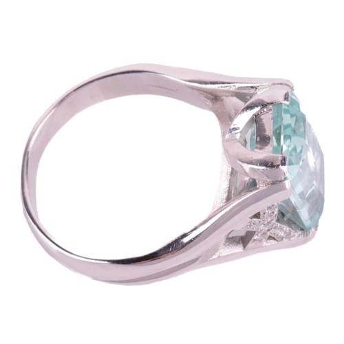 201 - A single stone aquamarine dress ring, the mixed rectangular cut aquamarine, with double claw mounts,... 