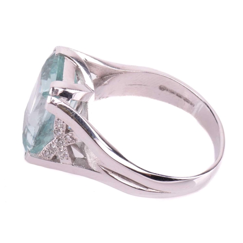 201 - A single stone aquamarine dress ring, the mixed rectangular cut aquamarine, with double claw mounts,... 