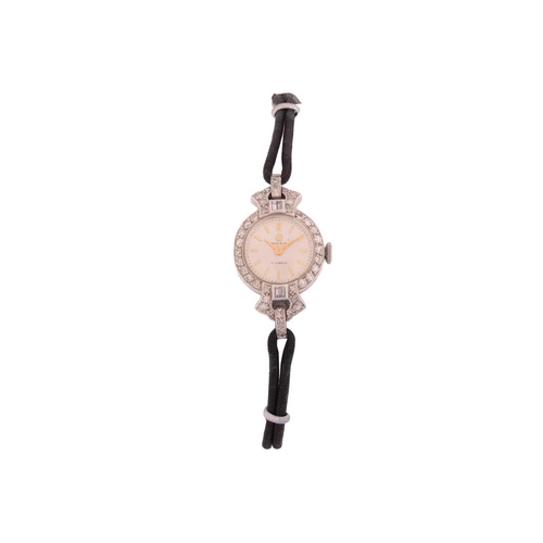 202 - A diamond cocktail watch with cord and leather strap, a split pearl and rose cut diamond stick pin, ... 