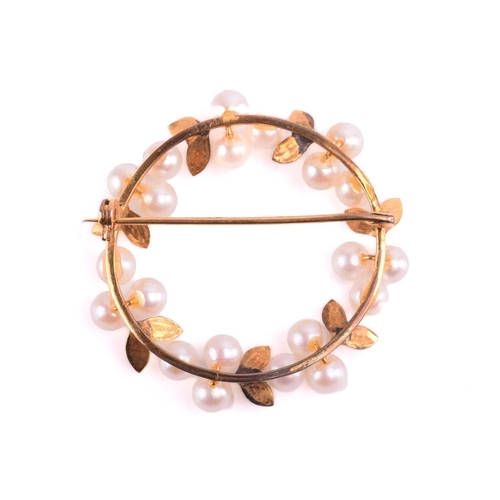 204 - A cultured pearl wreath brooch in yellow metal, measuring 37mm in diameter, a sapphire and diamond b... 