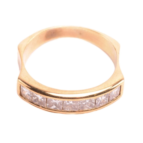 21 - A diamond half hoop ring, set with a row of princess cut diamonds with a total estimated weight of 0... 