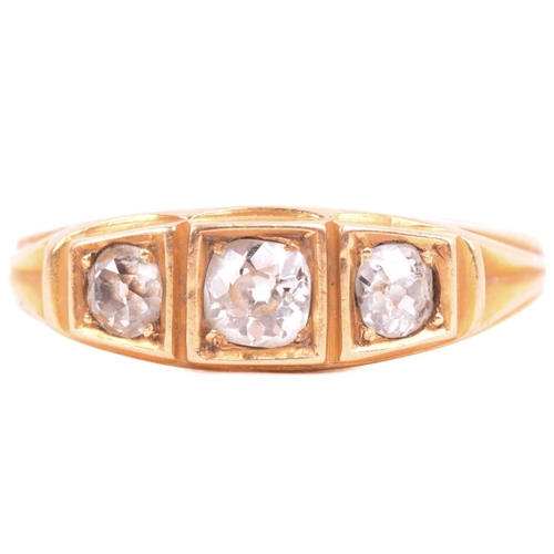 213 - A three-stone diamond half-hoop ring, scintillating with three graduated old-cut diamonds, with an e... 