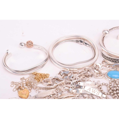 216 - A collection of white metal jewellery including various bangles, bracelets including identity bracel... 