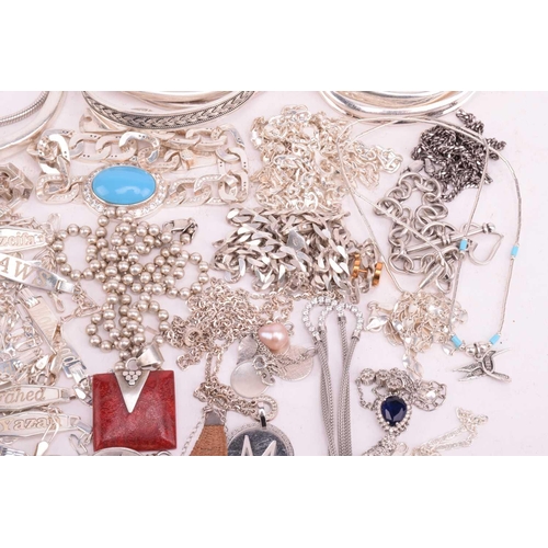 216 - A collection of white metal jewellery including various bangles, bracelets including identity bracel... 