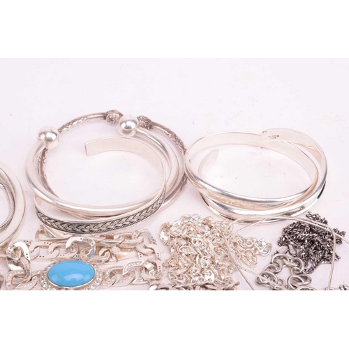 216 - A collection of white metal jewellery including various bangles, bracelets including identity bracel... 