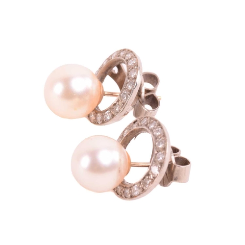 217 - A pair of cultured pearl and diamond halo earrings, the central pearls approximately 8.64 mm in diam... 