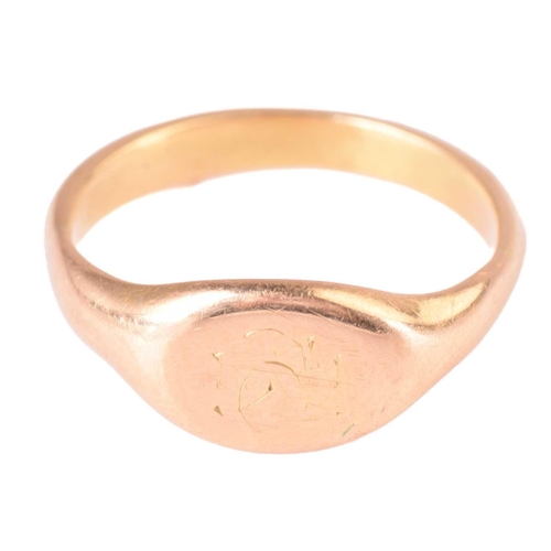 219 - A lady's signet ring testing as 18ct using an electronic gold tester, ring size I, a blister pearl l... 