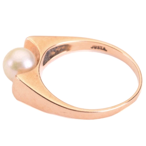 226 - A cultured pearl solitaire ring, set with a cream-coloured round pearl of 6.2 mm, in a concave mount... 