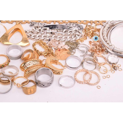 231 - A quantity of base metal costume jewellery comprising a collection of bangles including hinged examp... 