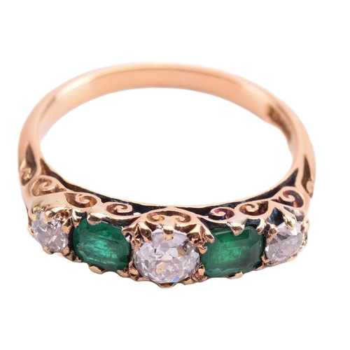 238 - An emerald and diamond five-stone carved half hoop ring, set with two emeralds and three old cut dia... 