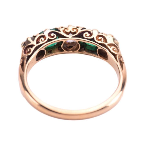 238 - An emerald and diamond five-stone carved half hoop ring, set with two emeralds and three old cut dia... 