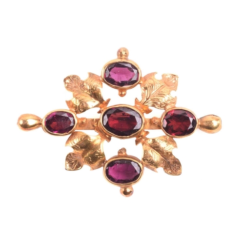 240 - A garnet pendant brooch, set with five garnets in a cross formation, the central garnet measuring 10... 