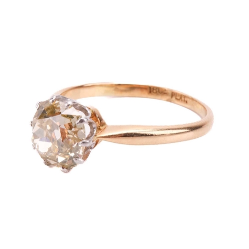 247 - A single stone diamond ring; the old cushion cut diamond in simple ten claw mount to an 18-carat gol... 