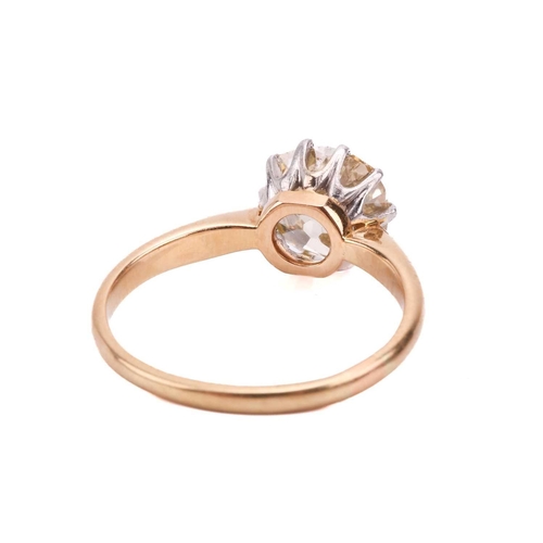 247 - A single stone diamond ring; the old cushion cut diamond in simple ten claw mount to an 18-carat gol... 