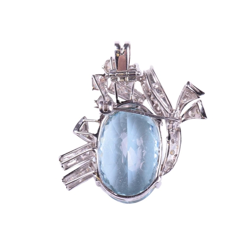 252 - An aquamarine and diamond brooch/pendant, the aquamarine measuring 23.3mm x 6.4mm x 10.6mm, within a... 