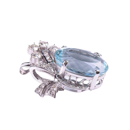 252 - An aquamarine and diamond brooch/pendant, the aquamarine measuring 23.3mm x 6.4mm x 10.6mm, within a... 