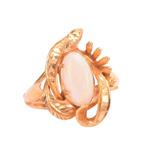 257 - An opal ring, set with white opal in a foliate asymmetric mount, the shank stamped 22K, ring size I.... 