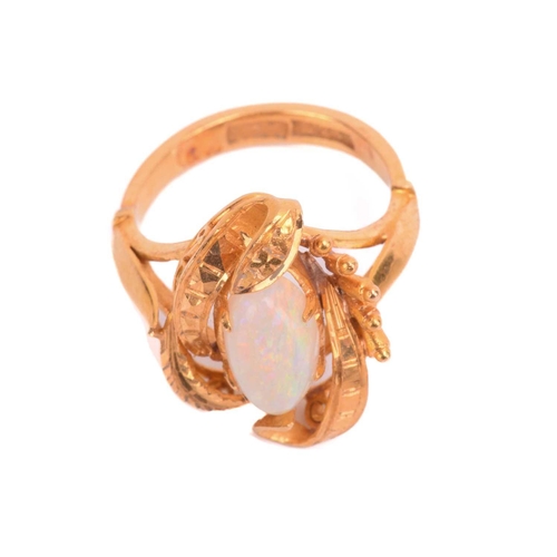 257 - An opal ring, set with white opal in a foliate asymmetric mount, the shank stamped 22K, ring size I.... 