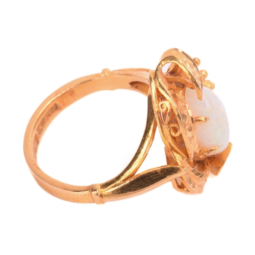 257 - An opal ring, set with white opal in a foliate asymmetric mount, the shank stamped 22K, ring size I.... 