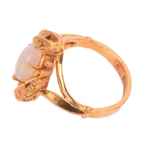 257 - An opal ring, set with white opal in a foliate asymmetric mount, the shank stamped 22K, ring size I.... 