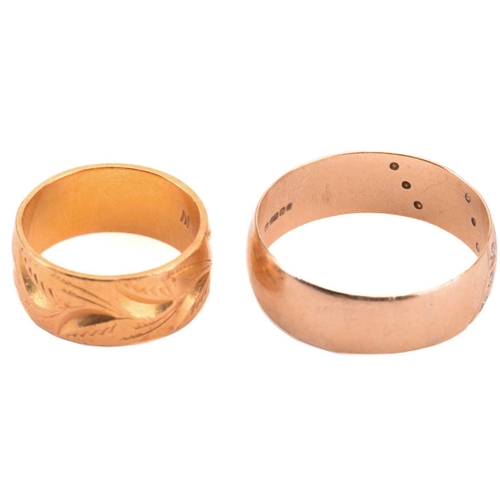 26 - Two wide wedding rings in yellow gold; the first comprises a flat band of 8.0 mm wide, with bright-c... 