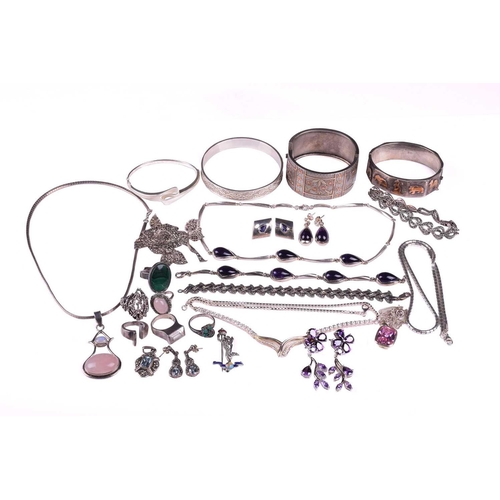 263 - A collection of mixed jewellery comprising a suite of amethyst jewellery set in white metal marked 9... 