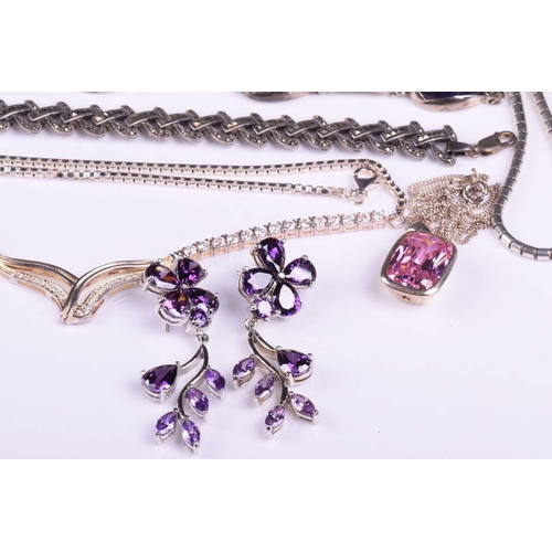 263 - A collection of mixed jewellery comprising a suite of amethyst jewellery set in white metal marked 9... 