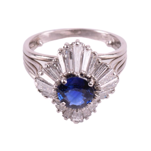 270 - A sapphire and diamond dress ring, centred with a circular-cut sapphire of bright blue colour, appro... 