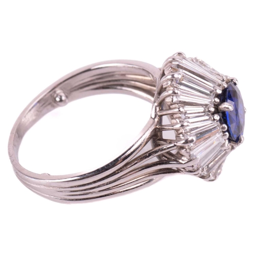 270 - A sapphire and diamond dress ring, centred with a circular-cut sapphire of bright blue colour, appro... 