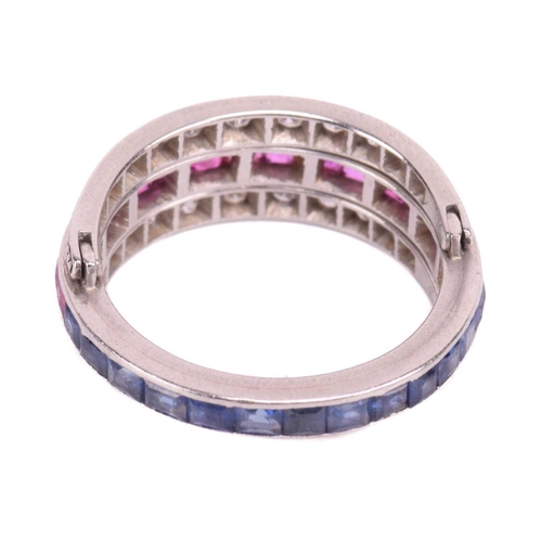 272 - An Art Deco 'Night and Day' flip-over eternity ring, with half of the central band channel set with ... 