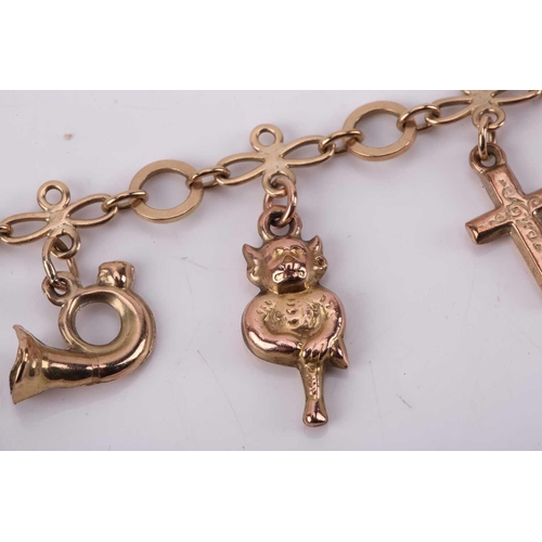 274 - A charm bracelet with various charms, some with hallmarks for 9ct gold, the bracelet measuring 18cm ... 