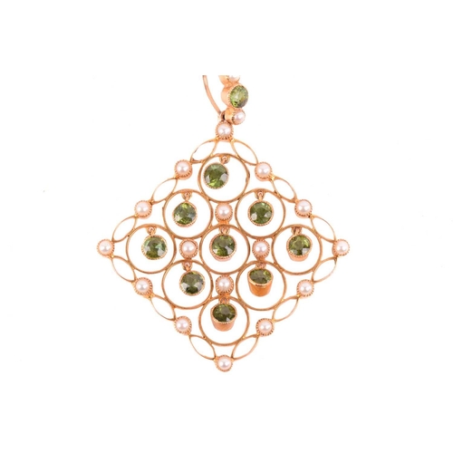 286 - An Edwardian tourmaline and seed pearl pendant, circa 1910, the beautiful lozenge shape design set w... 