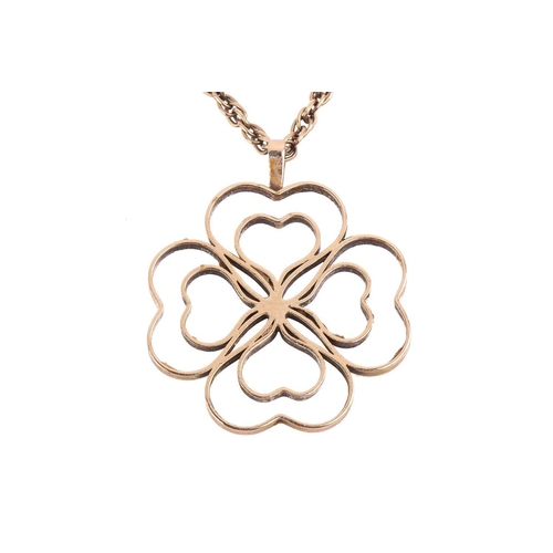 293 - A gold quartrefoil pendant, in the form of a four leaf clover measuring 44mm wide, with English hall... 